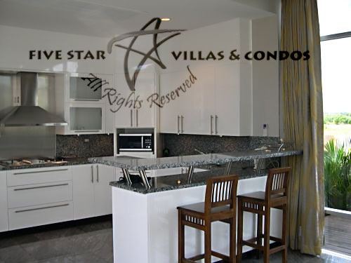 House for sale with pool at Na Jomtien showing the kitchen House for sale with pool at Na Jomtien showing the kitchen