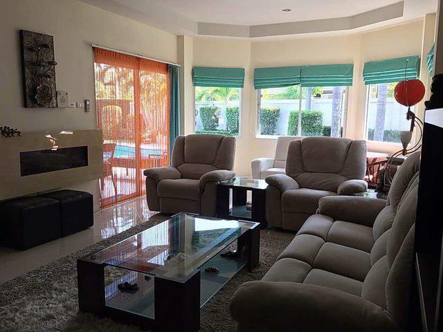 House for sale East Pattaya showing the living area looking over the pool House for sale East Pattaya showing the living area looking over the pool