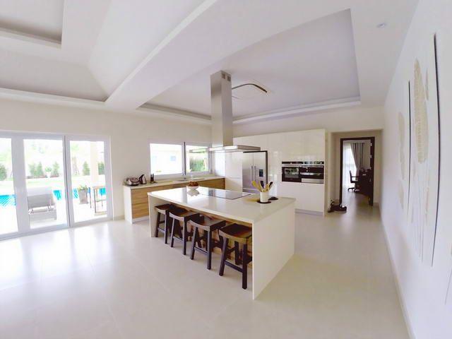House for sale East Pattaya showing the kitchen area and pool beyond House for sale East Pattaya showing the kitchen area and pool beyond