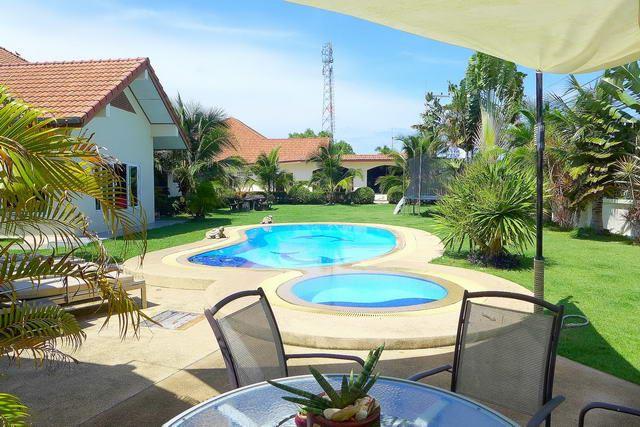 house for sale east pattaya showing the swimming pool and garden house for sale east pattaya showing the swimming pool and garden