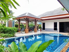 House for Sale Pattaya showing the house, garden and pool 