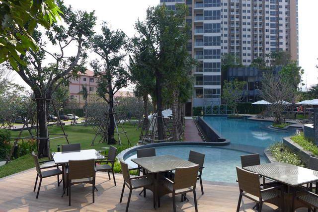 Condominium for sale Pattaya showing the pool and building  
