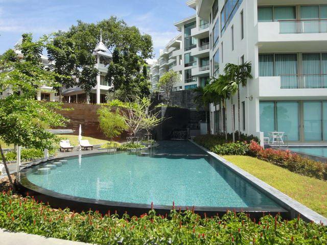 Condominium For Sale Wongamat Pattaya showing a communal swimming pool Condominium For Sale Wongamat Pattaya showing a communal swimming pool