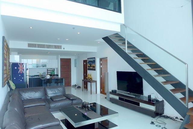 Condominium for sale Pattaya showing the timber stairway to the upper floor