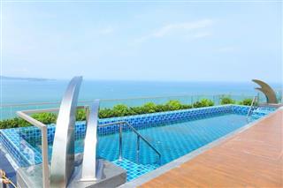 Condominium for sale Pratumnak Hill Pattaya showing the communal swimming pool with sea view