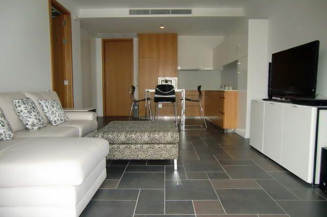 Condominium for sale in Naklua showing the sitting area with TV Condominium for sale in Naklua showing the sitting area with TV