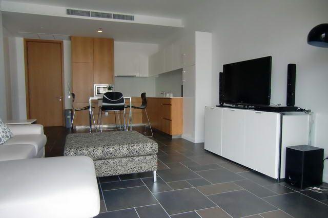 Condominium for sale in Naklua showing the sitting area and TV Condominium for sale in Naklua showing the sitting area and TV