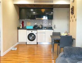 Condominium for sale Jomtien showing the kitchen and dining areas
