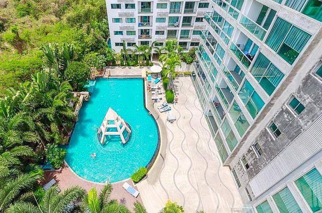 Condominium for sale Wong Amat showing the condo building and pool