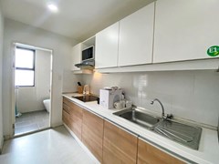 Condominium for Rent Pattaya showing the  kitchen and guest bathroom 