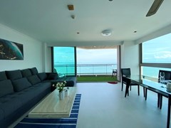 Condominium for rent Pattaya showing the living area and balcony 