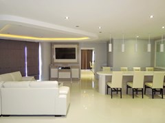 Condominium for Rent Wongamat Pattaya showing the living and dining areas with TV