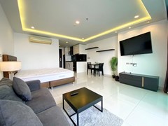 Condominium for sale Wong Amat Pattaya showing the living and sleeping areas 