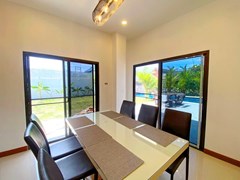 House for rent Mabprachan Pattaya showing the dining area with pool view 