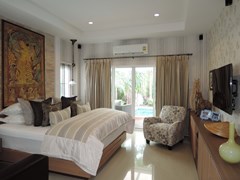 House for sale Huay Yai Pattaya showing the master bedroom poolside