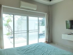 House for sale Huay Yai Pattaya showing the master bedroom with pool view 