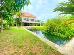 House for sale Huay Yai showing the fishpond and house