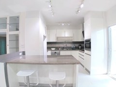 House for sale Mabprachan Pattaya showing the kitchen and breakfast bar 