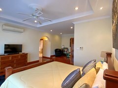 House for sale Mabprachan Pattaya showing the master bedroom with living area 