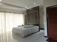 House for sale Na Jomtien Pattaya showing the master bedroom suite 