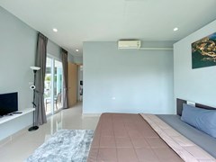 House for sale Na Jomtien showing the master bedroom suite 