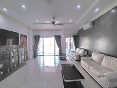 House for sale South Pattaya showing the living room with pool view 