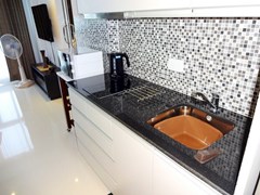 Condominium For Rent Pattaya showing the kitchen area