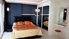 Condominium for rent Pattaya showing the sleeping area and built-in wardrobes