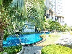 Condominium for sale Jomtien Pattaya showing the communal pool and terraces 