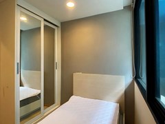 Condominium for sale Jomtien showing the second bedroom with  wardrobes 