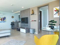 Condominium for sale Na Jomtien showing the dining, living and kitchen areas 