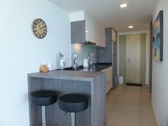 Condominium for sale Na Jomtien showing the kitchen and breakfast bar 