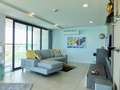 Condominium for sale Na Jomtien showing the living room and balcony 