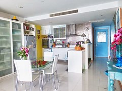 Condominium for sale Na Jomtien showing the dining, kitchen and entrance 