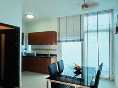House for sale East Pattaya showing the dining, kitchen and outside utility areas 