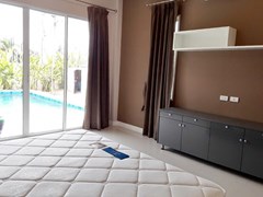 House for sale Huay Yai Pattaya showing the master bedroom pool view 