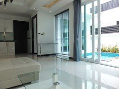 House for sale Jomtien showing the living area with pool view 
