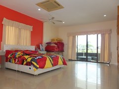 House for Sale Mabprachan Pattaya showing the master bedroom and balcony 