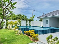 House for sale East Pattaya showing the garden and pool 