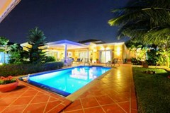 House for sale Siam Royal View Pattaya showing the pool and house at night