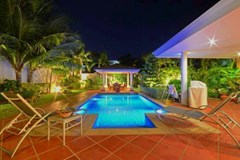 House for sale Siam Royal View Pattaya showing the pool and terraces at night