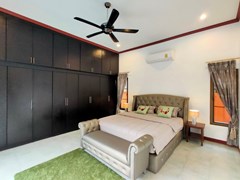 House for sale East Pattaya showing the master bedroom with built-in wardrobes 