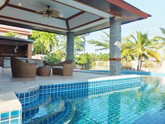 House for sale Huay Yai Pattaya showing the covered terrace bar and pool