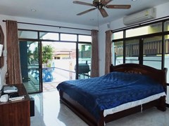 House for sale Pattaya Bangsaray showing the master bedroom and pool view 