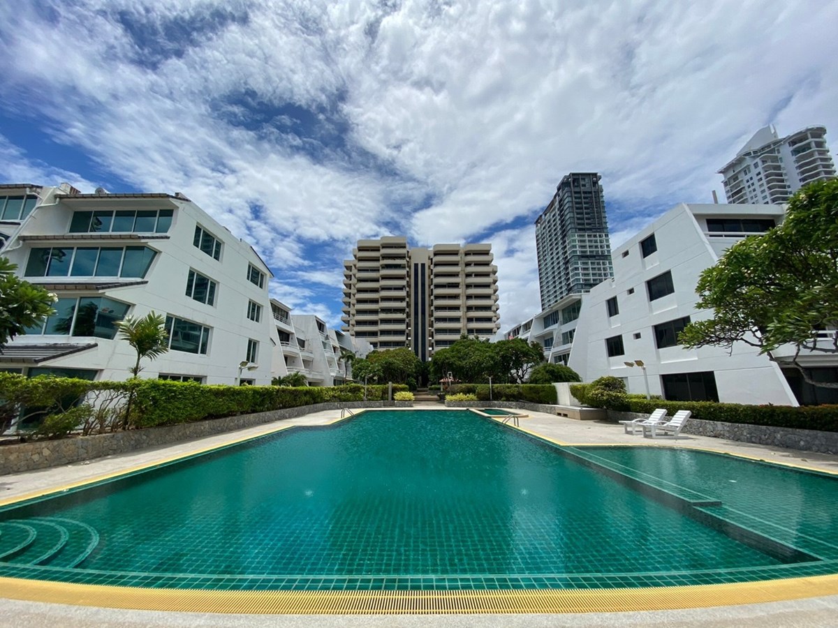 Condominium for sale Na Jomtien showing condo building and pool