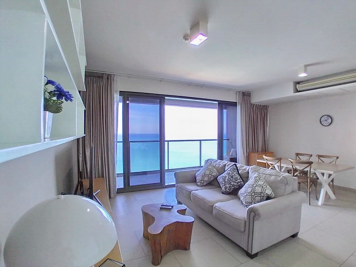 Condominium for rent Wong Amat Pattaya showing the living, dining areas and balcony Condominium for rent Wong Amat Pattaya showing the living, dining areas and balcony
