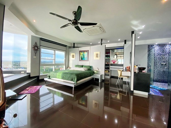 Condominium for sale Ban Amphur showing the master bedroom with walk-in wardrobes 