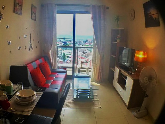 Condominium for sale UNIXX South Pattaya showing the living room and balcony 