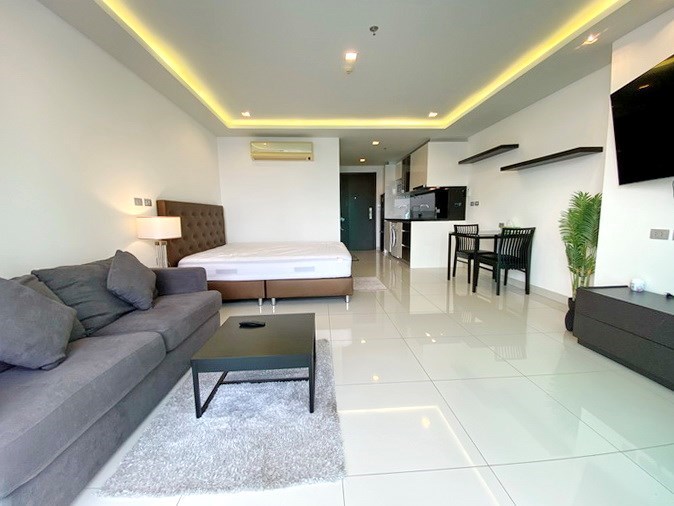 Condominium for sale Wong Amat Pattaya showing the living, dining and kitchen areas 