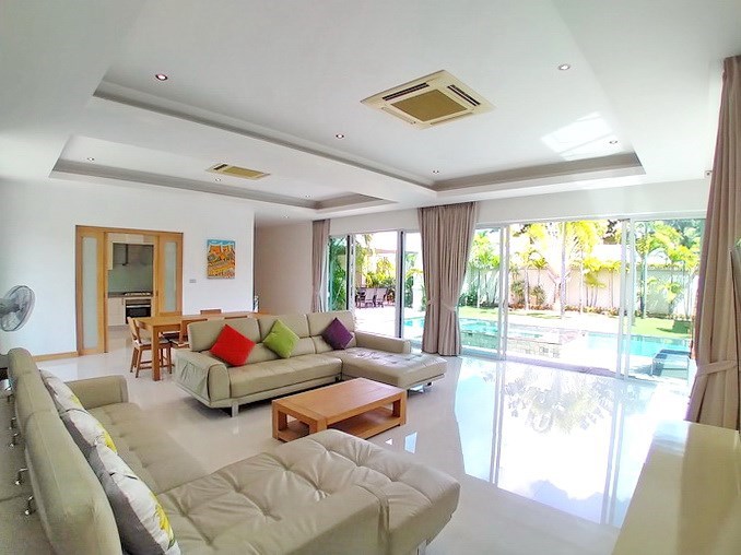House for rent at The Vineyard Pattaya showing the living and dining areas with pool view 